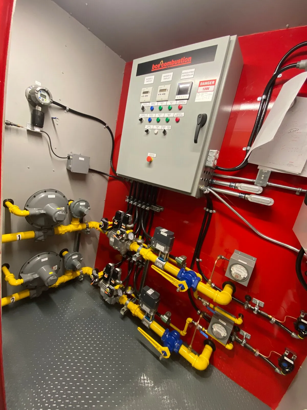 BCE Combustion burner management panel and gas train inside a heater module