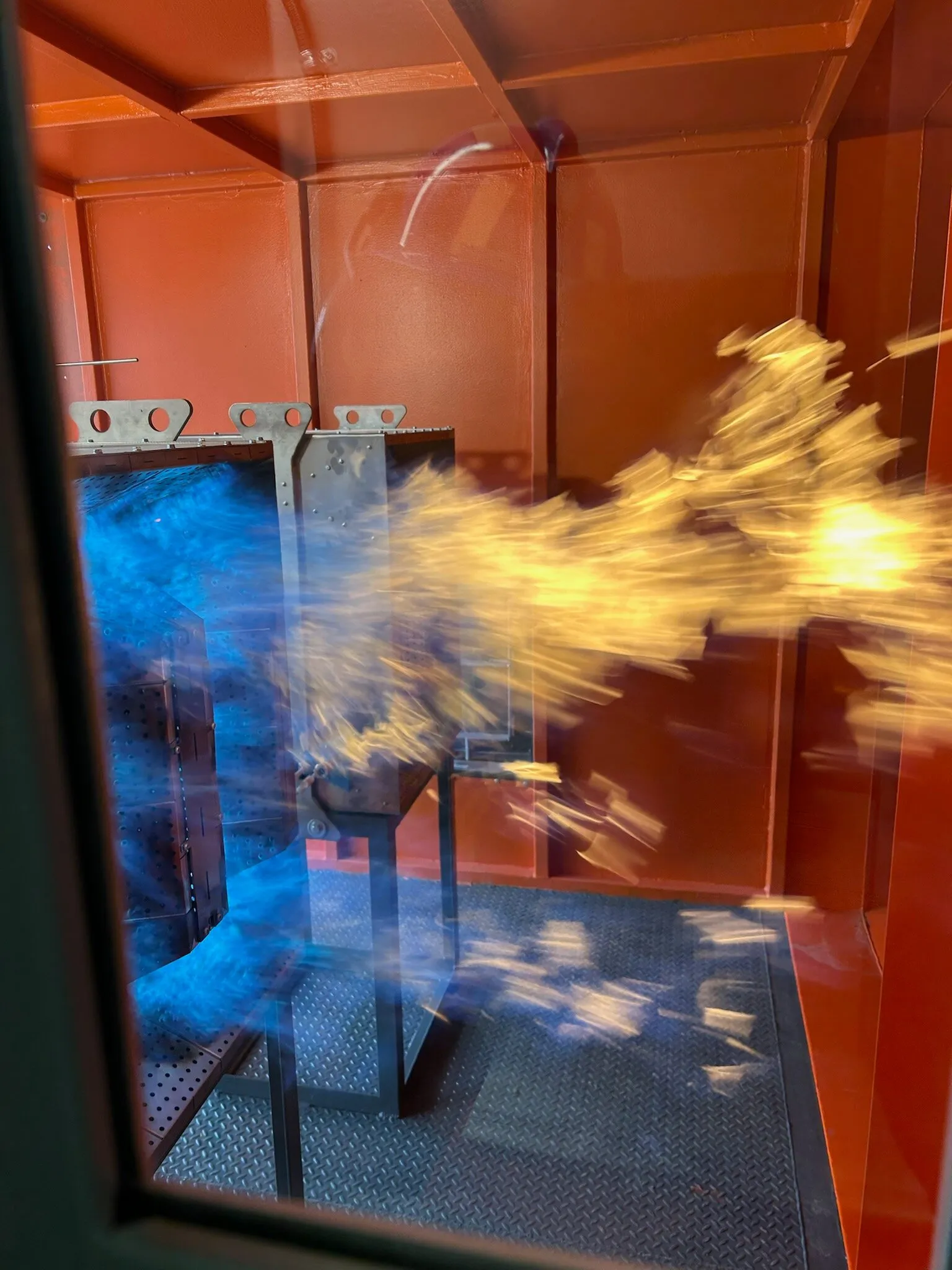 Burner flame seen through the inspection window of a mine air heater