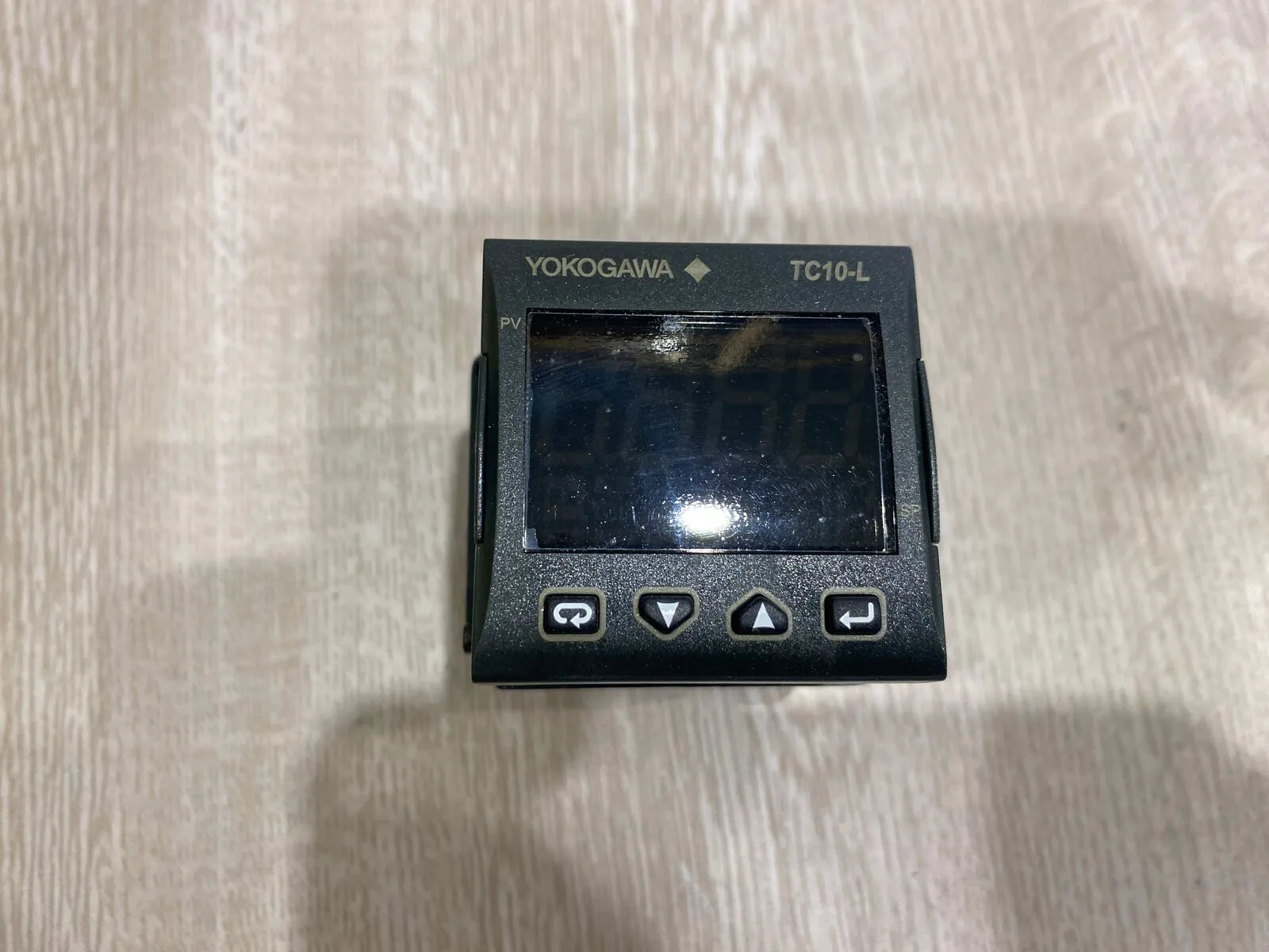 Yokogawa TC10-L panel-mount temperature controller, face up on the bench